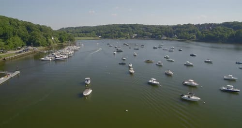Boats Docked at a Marina and Anchored on Cold Spring Harbor Forward Aerial Pan
