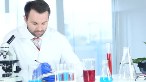 Scientist Analyzing Sample in Laboratory