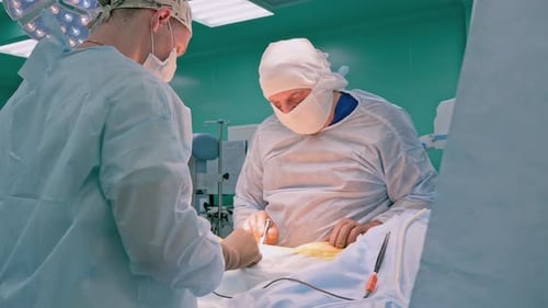 Surgeons Performing Operation in Hospital Operating Room