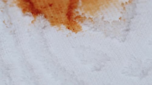 Barbecue Sauce Spilling on White Terry Cloth