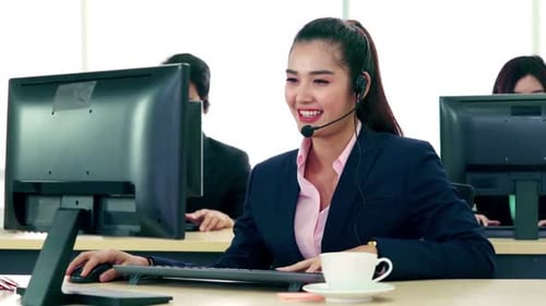 Business People Wearing Headset Working in Office