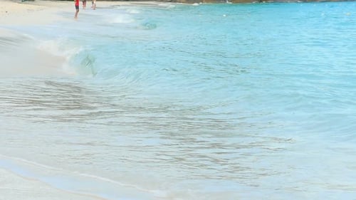 Waves Gently Washing Ashore on a Beach