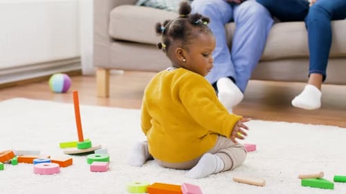 Cute Baby Playing with Colorful Wooden Blocks