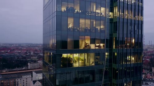 Modern Skyscraper with Glass Surface Late at Night