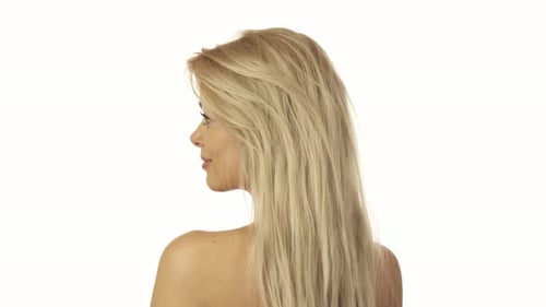 Woman with Blond Hair Turns and Smiles