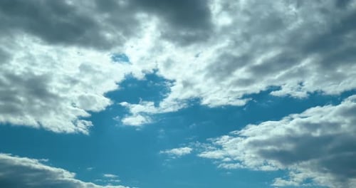 Clouds Drifting Across a Blue Sky