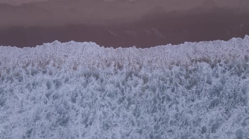 Aerial View of Wave Movement Into Shoreline