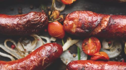 Grilled Sausages with Tomatoes and Onions Close-Up