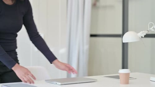 Woman Opens Laptop, Works in Modern Office