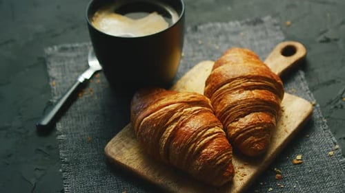 Coffee and Croissants on Dark Gray Table