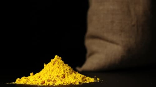 Bright Yellow Spice Pile Close Up Shot