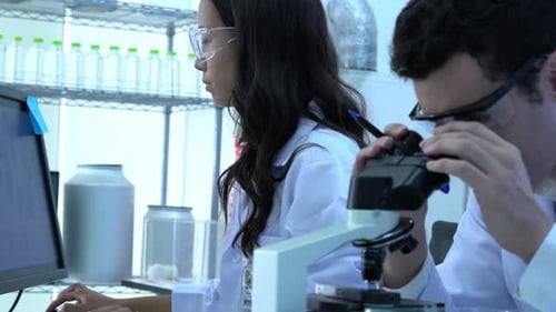 Scientist and microscope