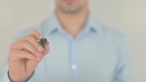 Adult Writes Yes I Can with Marker