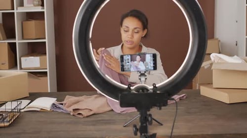 Young Woman Vlogging Fashion with Smartphone and Ring Light