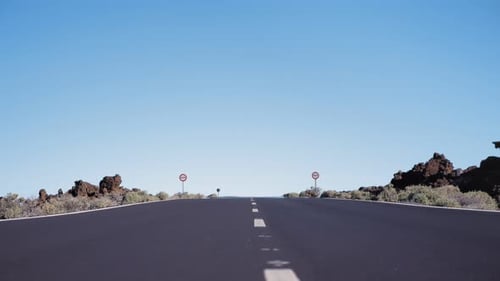 Pan Above the Asphalt Surface of the Road with Road Markings