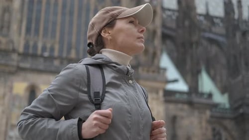 Tourist on the background of the Gothic temple.