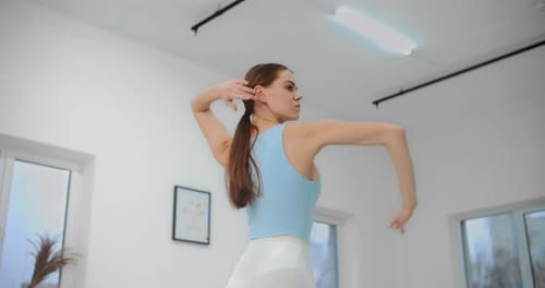 Dancer Warms Up Before Rehearsal in the White Bright Dance Hall, Ballet Rehearsal, Ballerina in the
