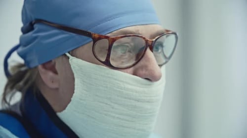 Close-Up of a Doctor in Surgical Cap