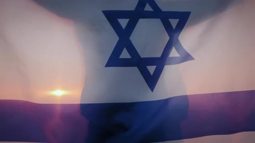 Israeli Flag Waving in the Wind at Sunrise
