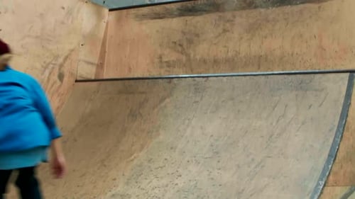 Young Adult Skateboarding on Skate Ramp