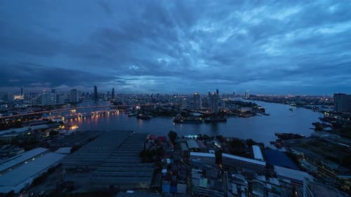 Time lapse of aerial view of Taksin Bridge with Chao Phraya River, Bangkok Downtown.