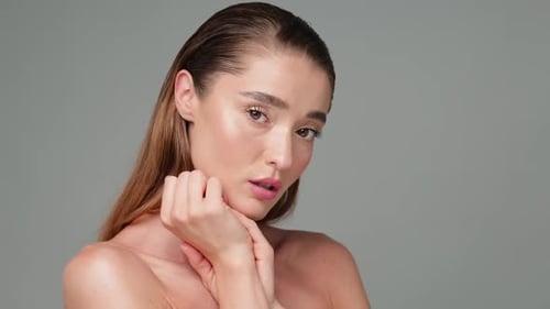 Young Woman Posing with Wet Hair in Studio