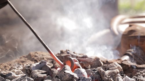 Burning Charcoal and Metal Tool