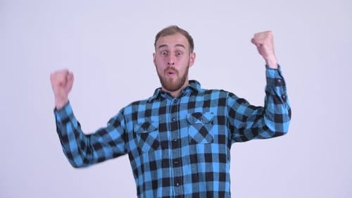 Excited Man Celebrating Success with Fist Pumps