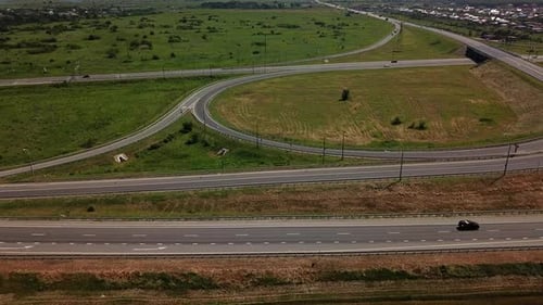 Aerial View of Modern Highway Road Intersection on Rural Landscape