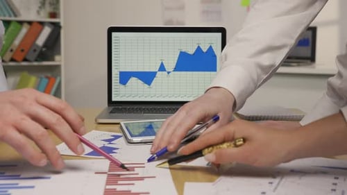 Team Analyzes Financial Data in Modern Office