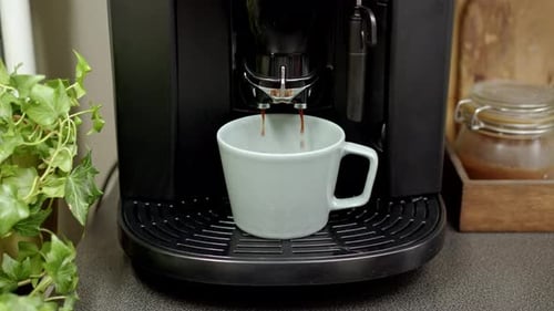 Coffee Machine Pouring Coffee into a Mug