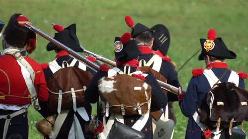 Historical Soldiers Marching with Rifles in Rural Setting