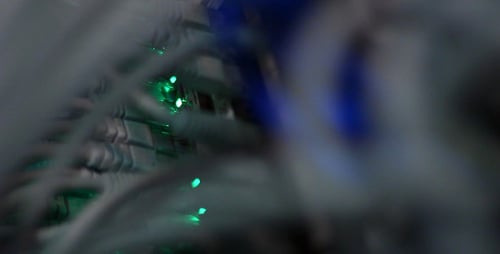 Computer Wires Connecting the Internet with Blinking Green Lights