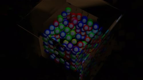 Abstrakte blinkende Kugeln in einem Glaswürfel