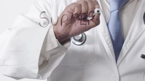 Asian Doctor Writing Surgery