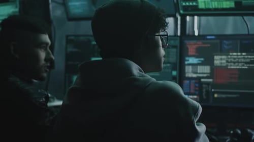 Male Criminals Discussing Hacker Attack