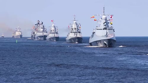 A line ahead of modern russian military naval battleships warships in the row