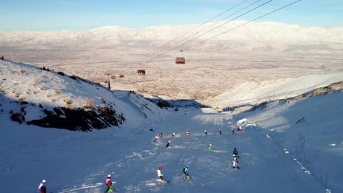 Skiers Enjoying a Day on Snowy Mountain