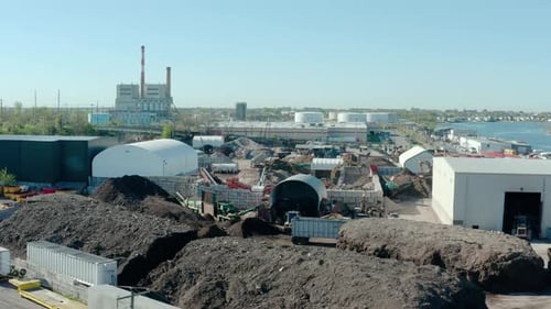 Wide Drone Shot of City's Industrial Zone Hangars Plants and Industrial Equipment