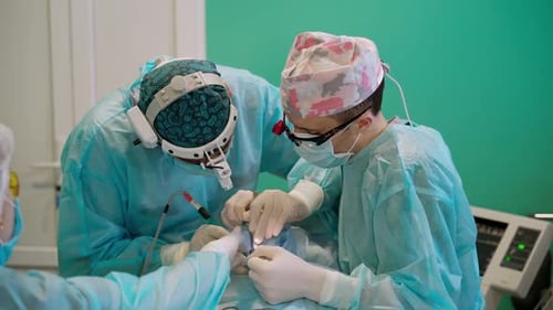 Operating of patient in modern hospital.