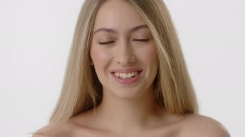 Beautiful Blonde Woman Smiling in Close Up Portrait
