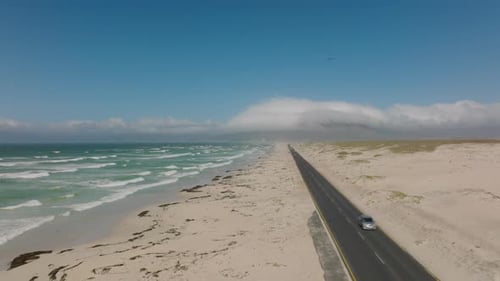Aerial View of Coastal Landscape with Sea Waves Washing White Sand Beach