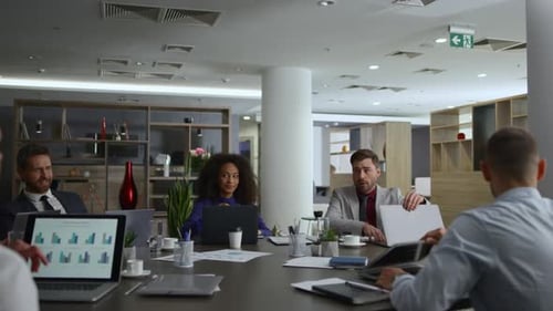 Diverse Business Group Meeting Talking Financial Plan in Company Office Table