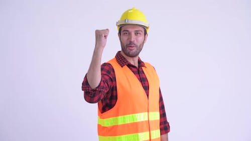 Construction Worker Celebrates Success in Safety Gear