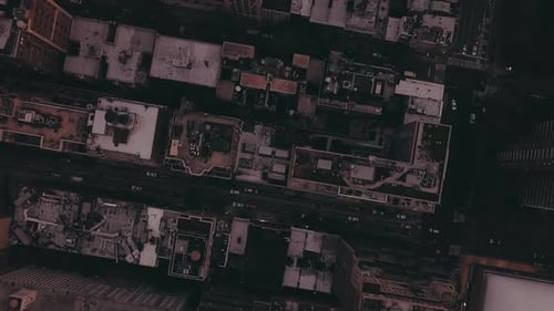 AERIAL: Overhead View of Skyscraper Building Rooftops in Manhattan New York City at Dawn