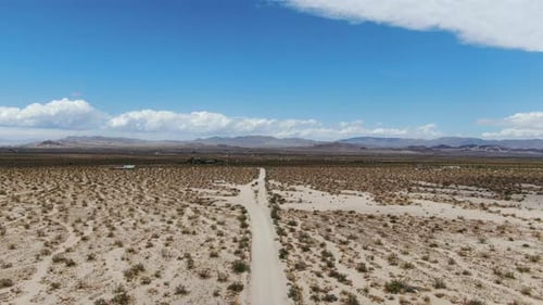 Aerial View of Endless Desert Straight Dust Off Road in Joshua Tree Park. USA