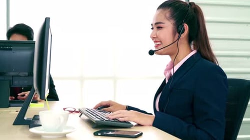 Business People Wearing Headset Working in Office