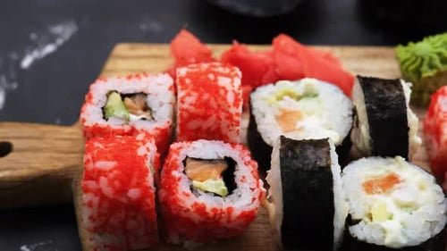 Delicious Sushi Rolls Displayed on Cutting Board