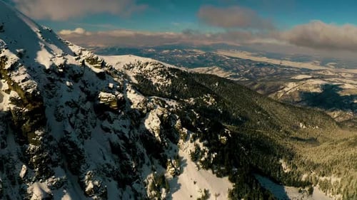 Aerial View of Snow-Covered Mountain Range