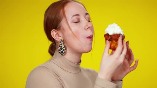 Closeup Headshot of Charming Redhead Woman with Green Eyes Enjoying Sweet Delicious Dessert at